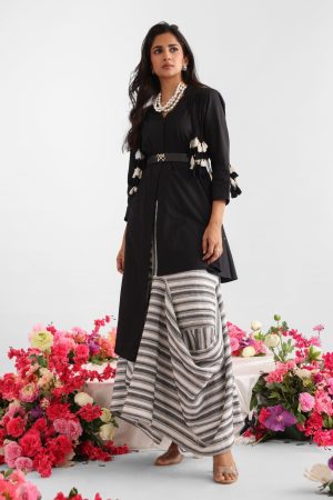Cotton top with black and white tassel shoulder detailing paired with asymmetric striped drape skirt – Golden Muslin