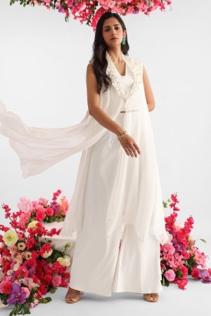White georgette cape with 3D floral details and pearl embroidery paired with white crop top and flared pants – Golden Muslin