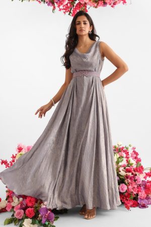 Grey gown with gold foil finish, cowl neckline, and signature Golden Muslin logo belt