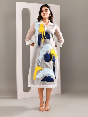 “Golden Muslin sheer organza multicolour patched overlay dress worn over a neutral sleeveless base dress.”