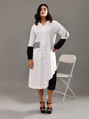 “Golden Muslin white and black blended cotton color-blocked dress with organza floral sleeve and pocket patches.”