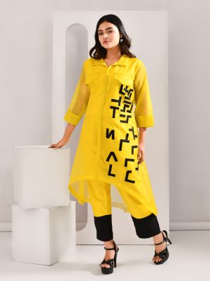 Yellow and black blended cotton co-ord set with sheer organza outer, patchwork detailing, pocket-style yoke, asymmetric hemline, and color-blocked pants – Golden Muslin