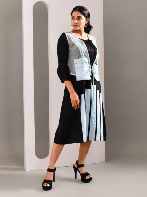 “Golden Muslin black and light blue blended cotton midi jacket dress with subtle patchwork, front waist tie, and sheer color-accented jacket.”