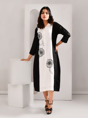 “Golden Muslin black and white blended cotton dress with intricate embroidered organza patch detailing.”