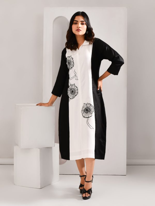 “Golden Muslin black and white blended cotton dress with intricate embroidered organza patch detailing.”