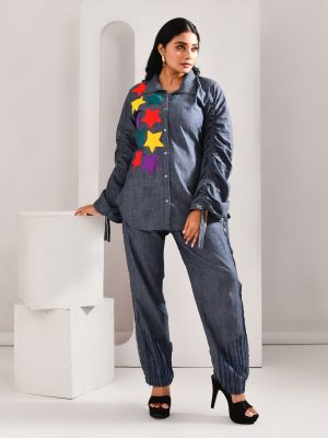 “Golden Muslin denim blue blended cotton shirt with contrasting star motifs across the body.”