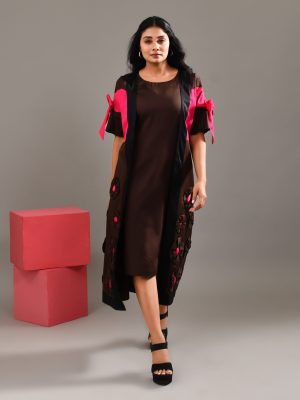 “Golden Muslin chocolate brown blended cotton dress with paneled jacket overlay, bow detail, and intricate patchwork.”