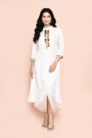 Golden Muslin Jaanvi Mohta ivory silk blend draped tunic with gold embellishments on the neckline and sleeve hem