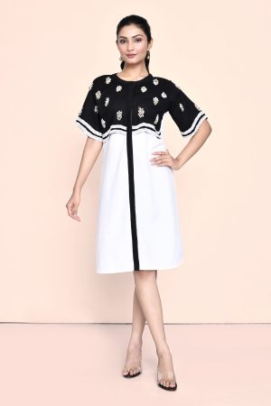 Golden Muslin Jaanvi Mohta black and white color-blocked poplin dress with stylized sleeves, fabric ruching, and pearl embellishments