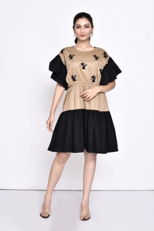 Golden Muslin beige and black color-blocked dress with chunky black embellishments and cut-out elasticated waistline
