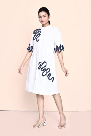 Golden Muslin white cotton dress with denim and pearl embellishments, featuring an elegant contemporary design