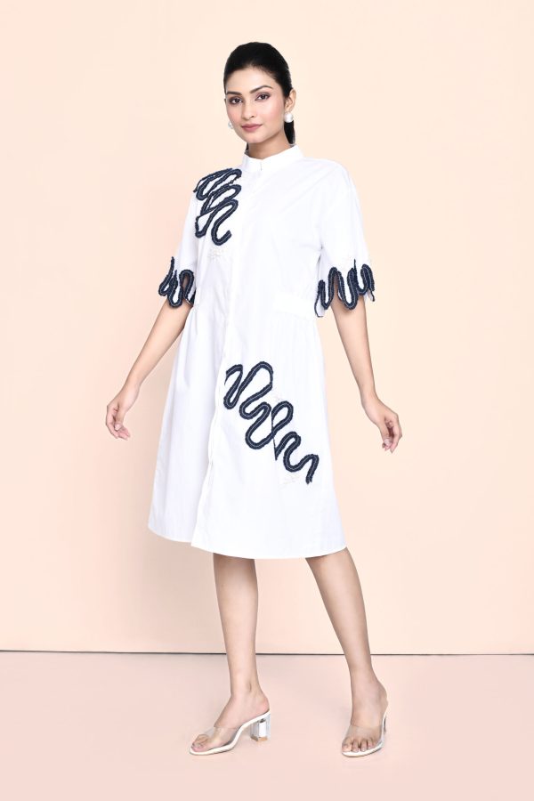 Golden Muslin white cotton dress with denim and pearl embellishments, featuring an elegant contemporary design