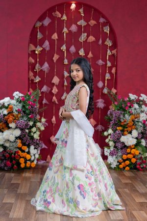 Off-white crepe girls’ lehenga set with heavy mirror-work V-neck blouse, multicolored floral embroidered lehenga, and sheer dupatta – Golden Muslin
