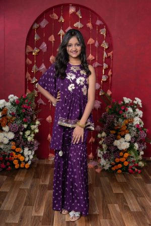 Purple crepe chiffon girls’ sharara set with printed kurti, delicate gota flower embellishments, and ruffled sharara bottoms – Golden Muslin