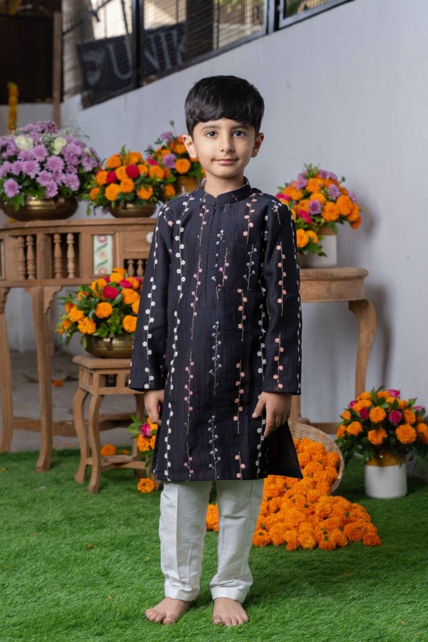 Black Chanderi silk kurta with intricate floral embroidery, mandarin collar, zipper closure, paired with white straight-cut pants – Golden Muslin