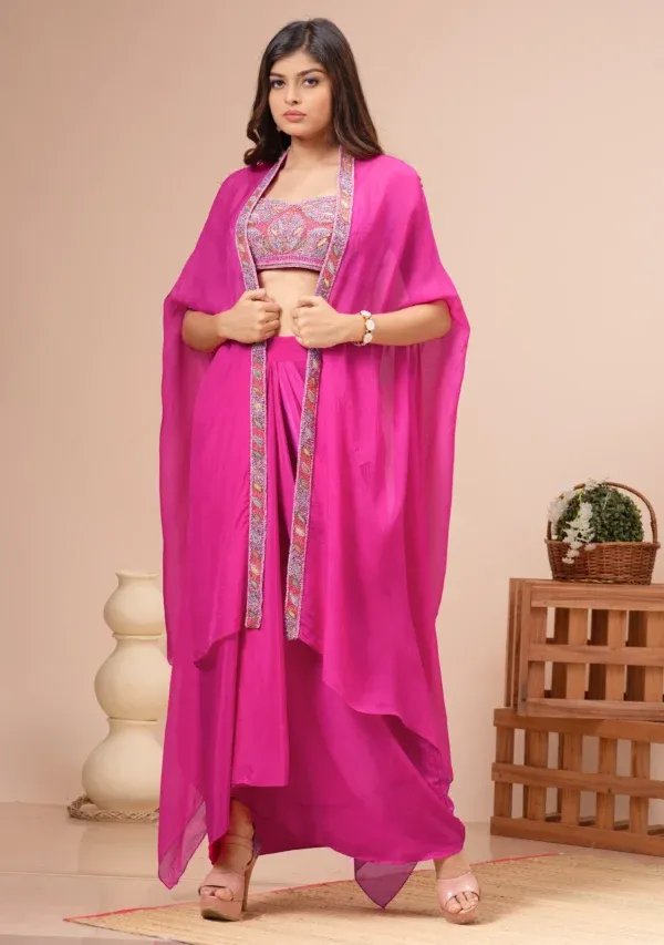 Fuchsia pink habutai silk fusion set with embroidered bustier and cape from the house of Golden Muslin by Kumar Rahul.