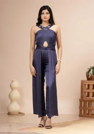Navy blue satin halter jumpsuit with a keyhole cutout and twisted waist By Kumar Rahul from the house of Golden Muslin.