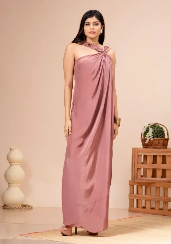 Dusty pink satin jumpsuit with a twisted neck and stone work from the house of Golden Muslin by Kumar Rahul.