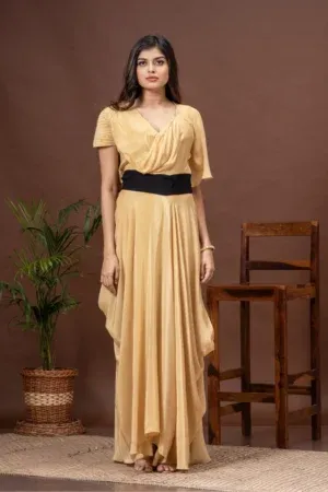 Beige V-neck crepe gown with cowls and asymmetric sleeves from the house of Golden Muslin by Kumar Rahul.