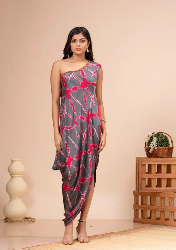 Grey and red tie-dye modal silk one-shoulder dress with zardosi scalloped neckline from the house of Golden Muslin by Kumar Rahul.