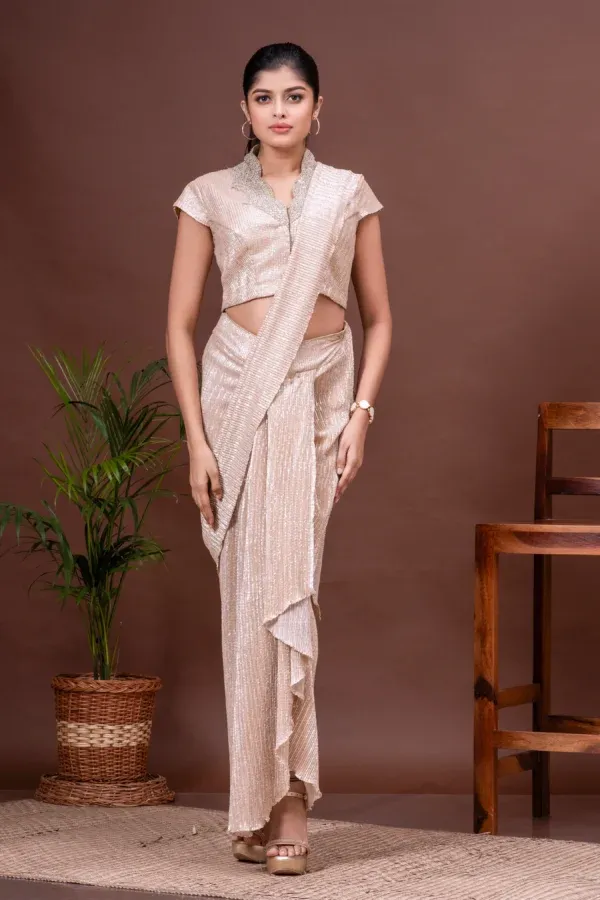 White gold shimmer pre-draped saree and embroidered blouse by Kumar Rahul from the house of Golden Muslin.