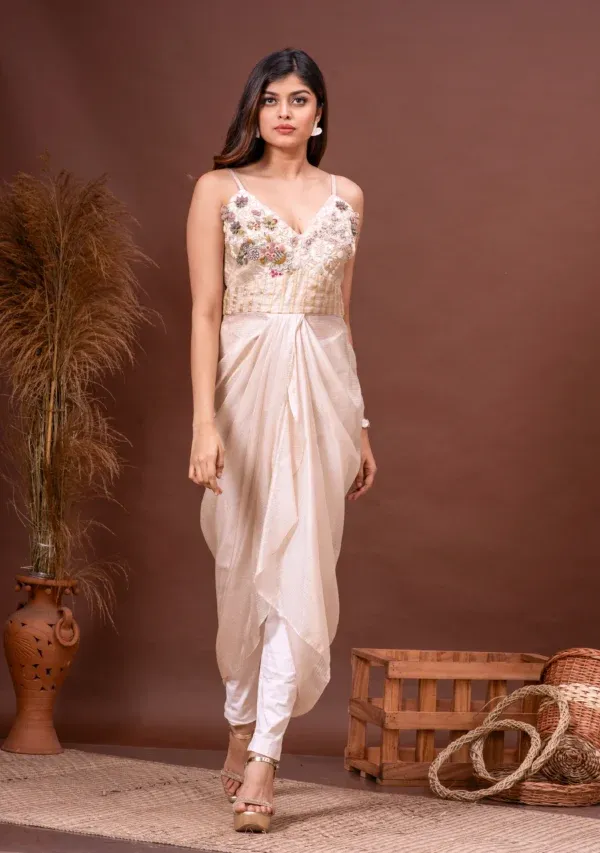 Beige zari kota doriya draped dress with floral zardosi on the bodice from the house of Golden Muslin by Kumar Rahul.