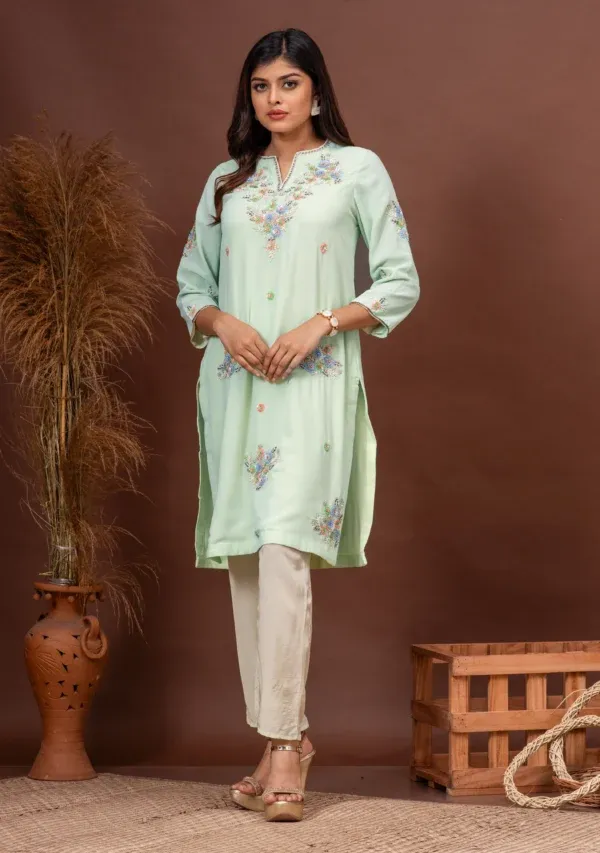 Mint green georgette floral sequin kurta with ivory pants By Kumar Rahul from the house of Golden Muslin.