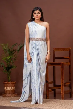 Sky blue tie-dye one shoulder draped gown with waist embroidery by Kumar Rahul from the house of Golden Muslin.