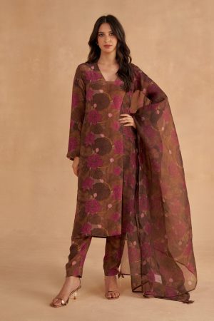 Golden Muslin walnut-brown crepe silk V-neck kurta with signature lotus print, paired with matching lotus-printed tapered pants and organza dupatta with printed detailing.