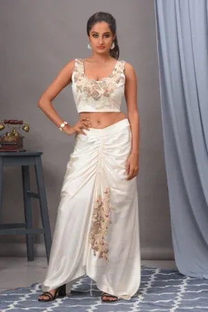 Ivory modal satin ruched skirt and embroidered bustier From the house of Golden Muslin By Satya JB with asymmetric design.