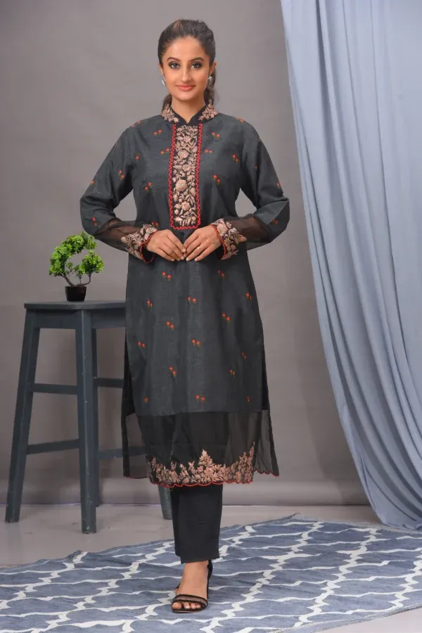 A greyish black straight kurta in Bamberg silk with intricate embroidery, paired with malai cotton pants by Satya JB from the house of Golden Muslin.
