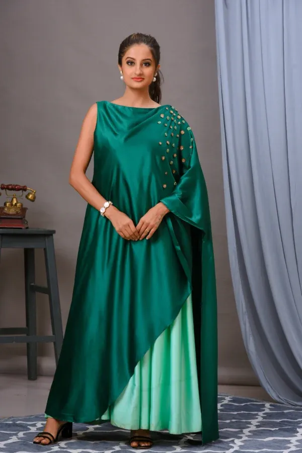 Turquoise and mint green pleated gown with an embroidered shoulder cape by Satya JB from the house of Golden Muslin.
