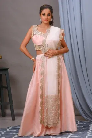 Salmon pink organza lehenga with an embroidered Bamberg silk blouse by Satya JB from the house of Golden Muslin.