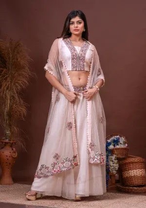 Nude pink foliage embroidered silk blouse and organza sharara by Satya JB from the house of Golden Muslin.
