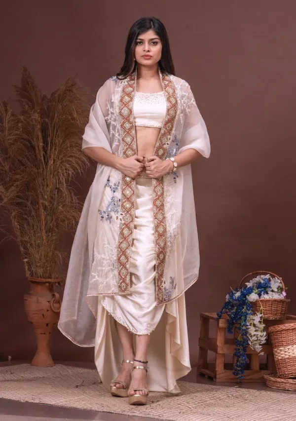 Beige embroidered bustier and cowl skirt by Satya JB from the house of Golden Muslin with organza dupatta.