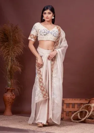 Beige modal satin draped skirt and embroidered silk blouse from the house of Golden Muslin by Satya JB.