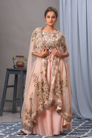 Baby pink silk cape and organza sharara from the house of Golden Muslin by Satya JB with floral scalloped edges.