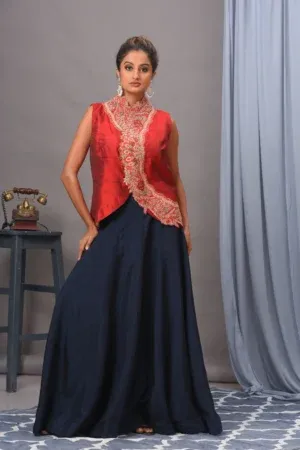 Red embroidered silk jacket and navy skirt from the house of Golden Muslin by Satya JB with heavy thread work.