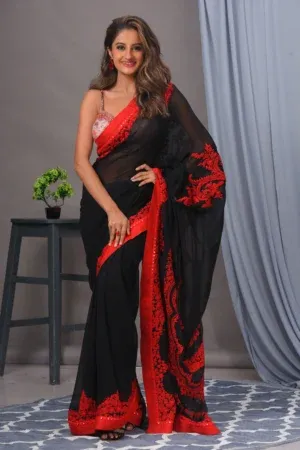 Black and red georgette sari with thread work by Satya JB from the house of Golden Muslin and cotton blouse.