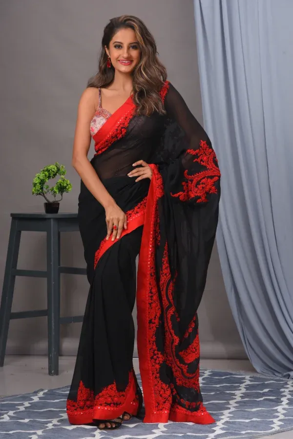 Black and red georgette sari with thread work by Satya JB from the house of Golden Muslin and cotton blouse.