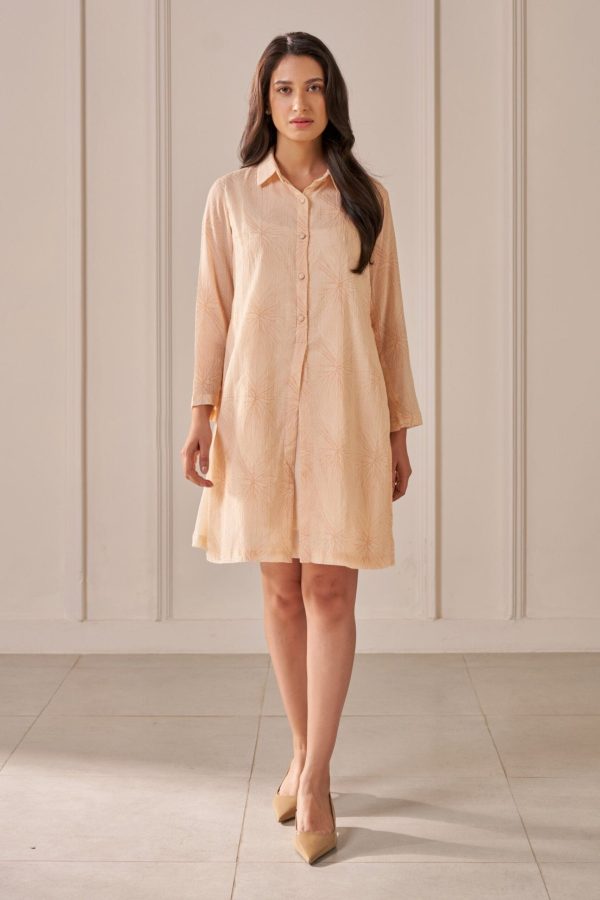“Golden Muslin soft peach printed crepe cotton straight-fit layered dress with shirt collar, button placket, and two-piece sleeves.”