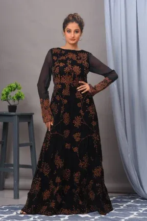 A stunning black velvet gown from Golden Muslin By Vivek Kumar, featuring intricate light-reflecting embroidery and a modern flattering silhouette.