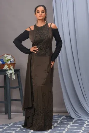 Elegant olive and black satin cold-shoulder gown with full sleeves, side drape detailing, and hand-embroidered cutdana work by Vivek Kumar from Golden Muslin.