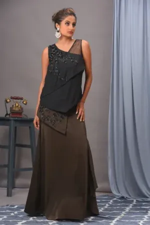 Exquisite black and olive green double georgette and satin skirt set from Golden Muslin By Vivek Kumar featuring a crisscross sleeveless top and embellished overlap skirt.