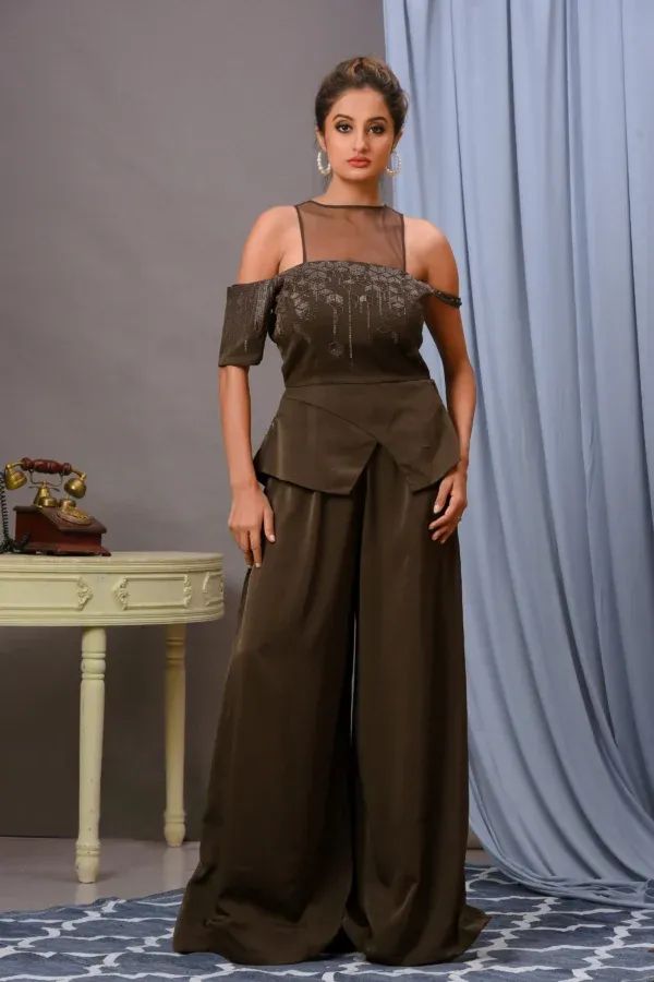 Olive green satin wide-leg jumpsuit by Vivek Kumar from Golden Muslin featuring cutdana embroidery.