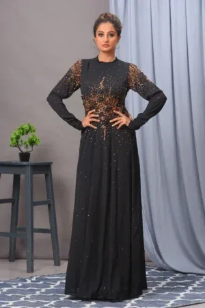 A stunning black chiffon gown from Golden Muslin By Vivek Kumar featuring intricate light-reflecting embroidery and a graceful contemporary drape.