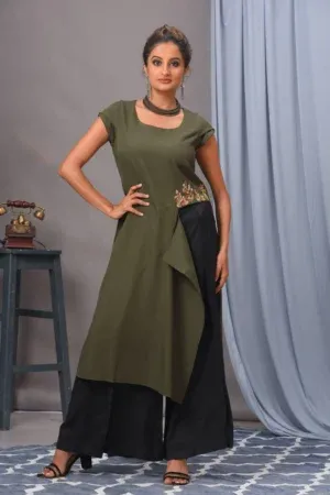 Olive green moss crepe tunic with waist thread work by Vivek Kumar from Golden Muslin with black pants.