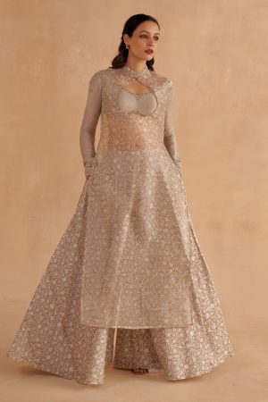 Golden Muslin warm grey Chanderi silk bustier blouse with Zardozi-embroidered sleeves, sleeveless block-printed organza kurta with keyhole neckline, and block-printed Chanderi Sharara pants.