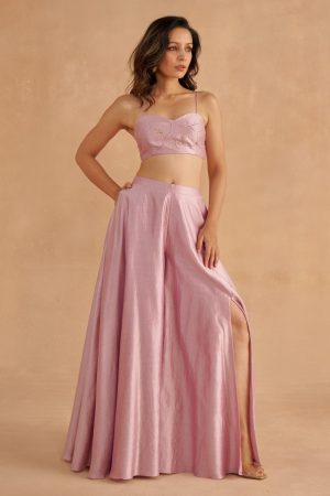 “Golden Muslin soft lilac sweetheart-neck blouse paired with fine silk lilac Sharara pants featuring waist belt, pockets, and modern slit.”