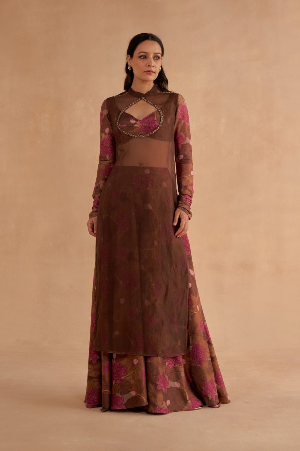 Golden Muslin walnut-brown bustier blouse with signature lotus print sleeves, sheer sleeveless kurta with keyhole neckline, and lotus-printed walnut-brown Chanderi Sharara pants with pockets and slit.